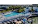 Community pool with lounge chairs, boats, and manicured landscaping for relaxing waterfront living at 11510 Shipwatch Dr # 1375, Largo, FL 33774