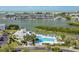Breathtaking aerial view of the pool area with nearby boat docks, and panoramic waterfront views at 11510 Shipwatch Dr # 1375, Largo, FL 33774
