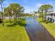 A serene view of the community pond and fountain with lush landscaping and manicured lawn at 11510 Shipwatch Dr # 1375, Largo, FL 33774