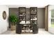 Stylish home office featuring a modern desk, shelving units, and ample natural light from the window at 11860 Blue Diamond Trl, Parrish, FL 34219