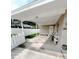 Carport featuring a swing and white trim at 1228 Pineview Ave, Clearwater, FL 33756