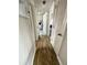 Hallway featuring light-colored wood-look floors, and white trim at 1228 Pineview Ave, Clearwater, FL 33756