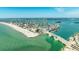 Coastal community with waterfront access, sandy beaches, and a scenic bridge at 12412 Lagoon Ln, Treasure Island, FL 33706