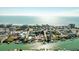Aerial view of canal-front homes near a stunning beach, perfect for boating and coastal living at 12412 Lagoon Ln, Treasure Island, FL 33706