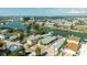 Stunning aerial view of waterfront property with boat docks and close proximity to the bay at 12412 Lagoon Ln, Treasure Island, FL 33706