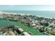 Waterfront homes with boat docks and a serene view of the ocean at 12412 Lagoon Ln, Treasure Island, FL 33706