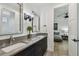 Bathroom showcasing dual sinks, modern fixtures, and access to a bedroom at 12707 Green Heron Way, Odessa, FL 33556