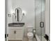 Stylish bathroom with a glass-enclosed shower, modern vanity, and sleek fixtures, offering a luxurious and contemporary feel at 12707 Green Heron Way, Odessa, FL 33556
