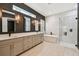 Bright primary bathroom with double vanity, soaking tub and tiled shower at 12707 Green Heron Way, Odessa, FL 33556