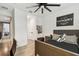 This bedroom features a cozy bed, personalized decor, and modern lighting for a comfortable and inviting space at 12707 Green Heron Way, Odessa, FL 33556