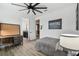 This bedroom features a modern ceiling fan, a cozy bed, and stylish decor for a comfortable and personalized living space at 12707 Green Heron Way, Odessa, FL 33556