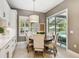 Cozy breakfast nook with a round table next to a large glass window and slider at 12707 Green Heron Way, Odessa, FL 33556