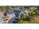 Aerial view of the Eagles Golf Club clubhouse, surrounded by palm trees and golf carts at 12707 Green Heron Way, Odessa, FL 33556