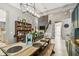 Dining area with a rustic table, decor display shelf, and stylish lighting at 12707 Green Heron Way, Odessa, FL 33556