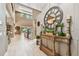 Grand foyer with high ceilings, a decorative clock, and stylish console table at 12707 Green Heron Way, Odessa, FL 33556
