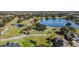 Aerial view of golf course at the Eagles Golf Club, with ponds and lush green fairways at 12707 Green Heron Way, Odessa, FL 33556