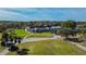 The Eagles Golf Club sits on a picturesque golf course with a well maintained clubhouse and trees at 12707 Green Heron Way, Odessa, FL 33556