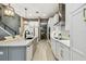 Bright and modern kitchen featuring white cabinets, island, and stainless steel appliances at 12707 Green Heron Way, Odessa, FL 33556