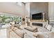 Comfortable living room featuring a fireplace and sliders to an outdoor living area at 12707 Green Heron Way, Odessa, FL 33556