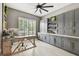Bright office space with built-in cabinetry and a modern work area, perfect for productivity at 12707 Green Heron Way, Odessa, FL 33556