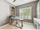Cozy home office with natural light, built-in cabinets and modern decor at 12707 Green Heron Way, Odessa, FL 33556