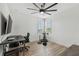 Office space with a desk, chair, a large window, and a stationary bike at 12707 Green Heron Way, Odessa, FL 33556
