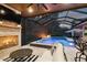 In-ground pool with hot tub and fire pit plus an outdoor fireplace and kitchen at 12707 Green Heron Way, Odessa, FL 33556