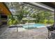 Impressive pool and patio with an outdoor fireplace and spa, perfect for enjoying the outdoors at 12707 Green Heron Way, Odessa, FL 33556