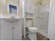 Bright bathroom featuring a shower, vanity with storage, and modern fixtures at 14734 11Th St, Dade City, FL 33523