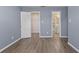 Bedroom with modern flooring and access to closet and bathroom at 14734 11Th St, Dade City, FL 33523