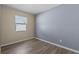 Comfortable bedroom features new flooring, a bright window, and neutral paint at 14734 11Th St, Dade City, FL 33523