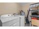 Spacious laundry room with washer, dryer, and additional storage for convenience at 14734 11Th St, Dade City, FL 33523