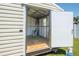 Interior view of the shed; wide open door and window offer a glimpse of the outdoor at 14734 11Th St, Dade City, FL 33523