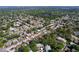 Overhead shot highlighting the community's layout, showcasing the density and neighborhood's proximity to a small pond at 1535 Nursery Rd # 107, Clearwater, FL 33756