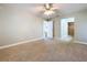 Neutral bedroom with doorway to hall and an ensuite bathroom at 1535 Nursery Rd # 107, Clearwater, FL 33756