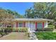 Charming single-story home features red shutters and well-maintained landscaping at 1535 Nursery Rd # 107, Clearwater, FL 33756