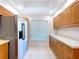 Bright kitchen showcasing stainless steel appliances and plenty of cabinet space at 1535 Nursery Rd # 107, Clearwater, FL 33756