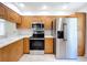 Well-lit kitchen showcasing stainless steel appliances and quartz countertops at 1535 Nursery Rd # 107, Clearwater, FL 33756