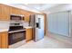 Updated kitchen with stainless steel appliances and modern fixtures at 1535 Nursery Rd # 107, Clearwater, FL 33756