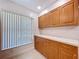 Spacious kitchen featuring a large window and ample cabinet space at 1535 Nursery Rd # 107, Clearwater, FL 33756