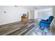 This open-concept living room boasts stylish wood flooring, and a cozy seating area at 1535 Nursery Rd # 107, Clearwater, FL 33756