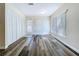 Bright living room with new flooring and large windows at 1535 Nursery Rd # 107, Clearwater, FL 33756