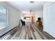 Cozy living room featuring updated flooring and plenty of natural light at 1535 Nursery Rd # 107, Clearwater, FL 33756