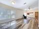 Spacious living room with ample natural light and modern flooring at 1535 Nursery Rd # 107, Clearwater, FL 33756