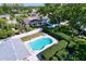 Backyard with a private in-ground pool, a surrounding patio, and a tall privacy fence, perfect for outdoor relaxation at 1535 Nursery Rd # 107, Clearwater, FL 33756