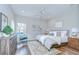 Serene bedroom with hardwood floors, neutral decor, and ample natural light at 16501 Sandhill Crane Dr, Spring Hill, FL 34610