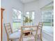 Bright breakfast nook with large windows offering outdoor views and natural light at 16501 Sandhill Crane Dr, Spring Hill, FL 34610