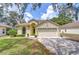 Charming home with a well-maintained lawn at 16501 Sandhill Crane Dr, Spring Hill, FL 34610