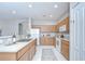 Functional kitchen with white appliances, ample counter space, and neutral cabinets, seamlessly connected to the dining area at 16501 Sandhill Crane Dr, Spring Hill, FL 34610