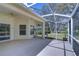 Spacious screened lanai with concrete floor at 16501 Sandhill Crane Dr, Spring Hill, FL 34610